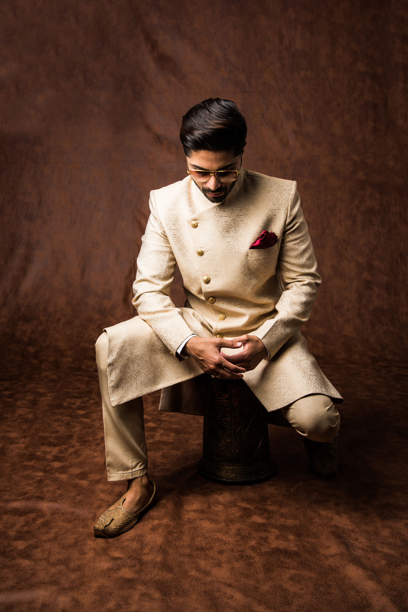 Indian Man Traditional Wear Kurta Pyjama Cloths Male Fashion Model Sherwani Posing Standing Against Brown Grunge Background Selective Focus 1 1 Scaled